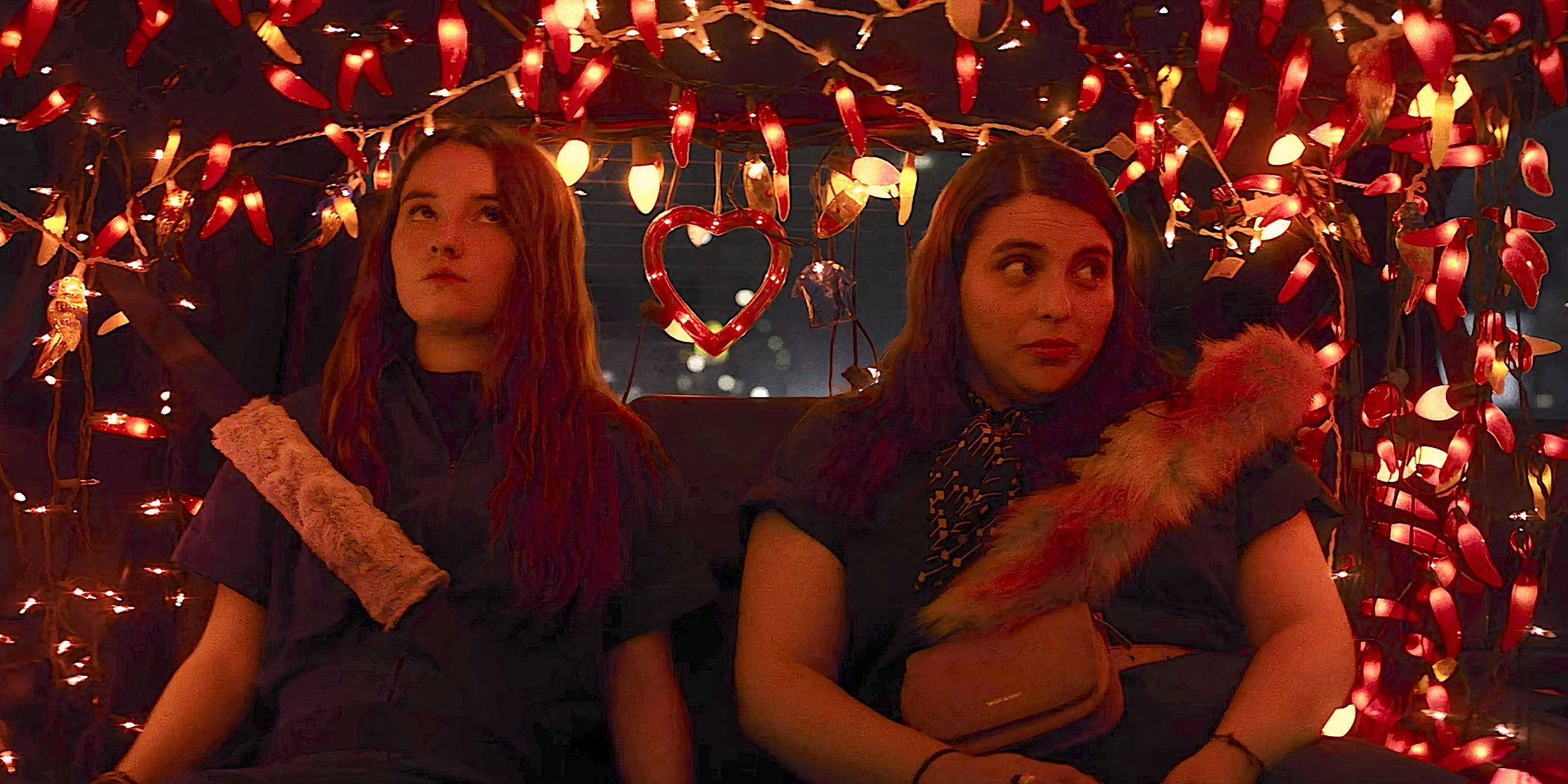 Kaitlyn (Amy Antsler) and Molly (Beanie Feldstein) endure an awkward rideshare that's decked out in fairy lights in Booksmart (2019)