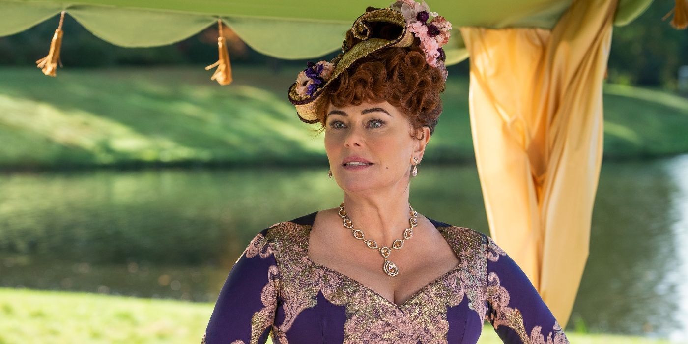 Polly Walker at a garden party in Bridgerton Season 1 Episode 2