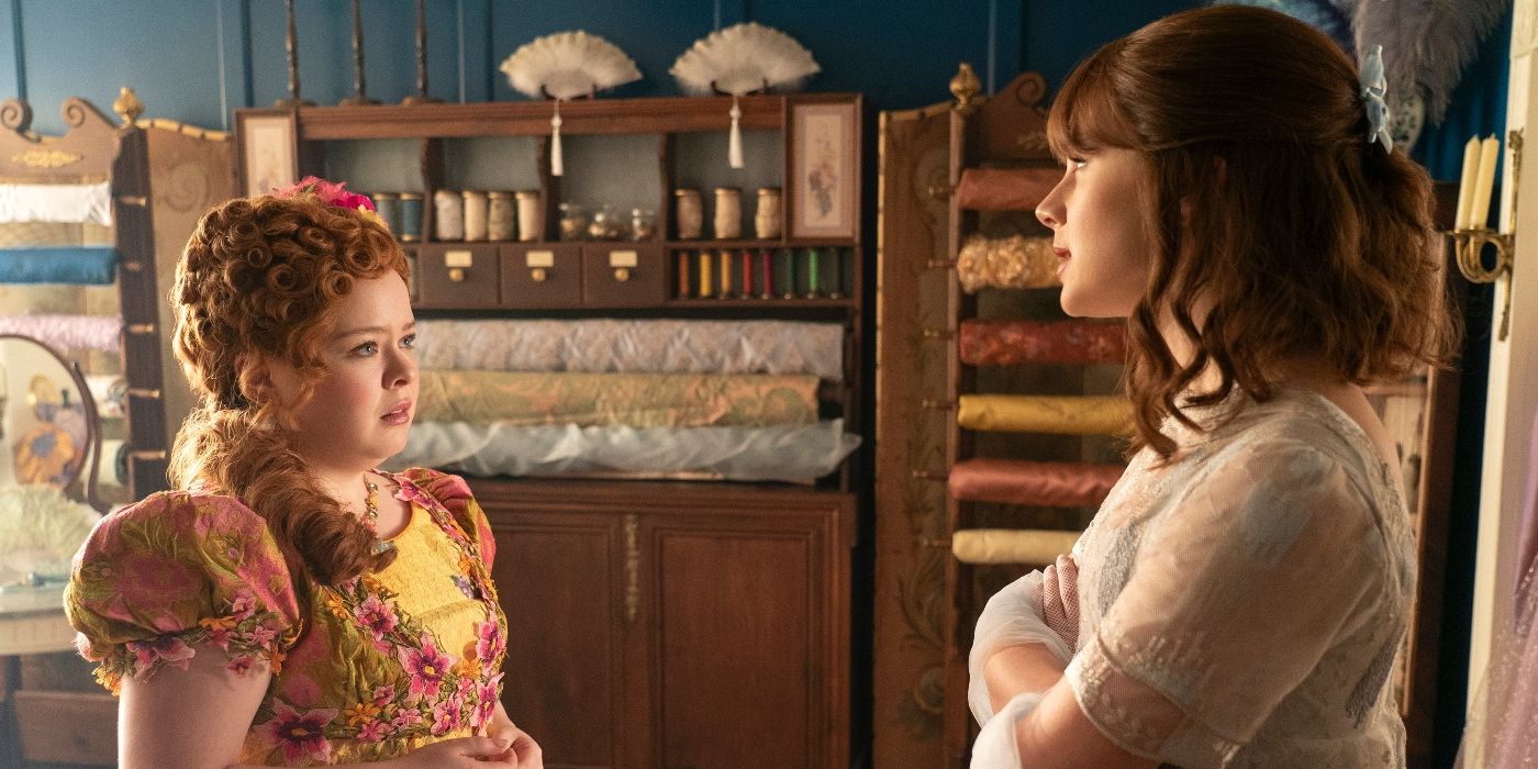 Nicola Coughlan and Claudia Jessie standing in Madame Delacroix's dress shop