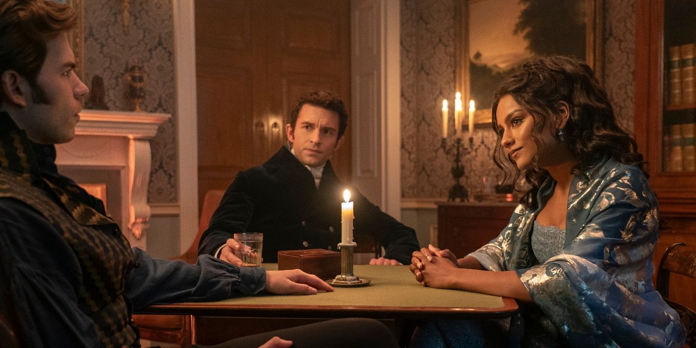 Luke Newton, Jonathan Bailey, and Simone Ashley sitting at a table in Bridgerton Season 3