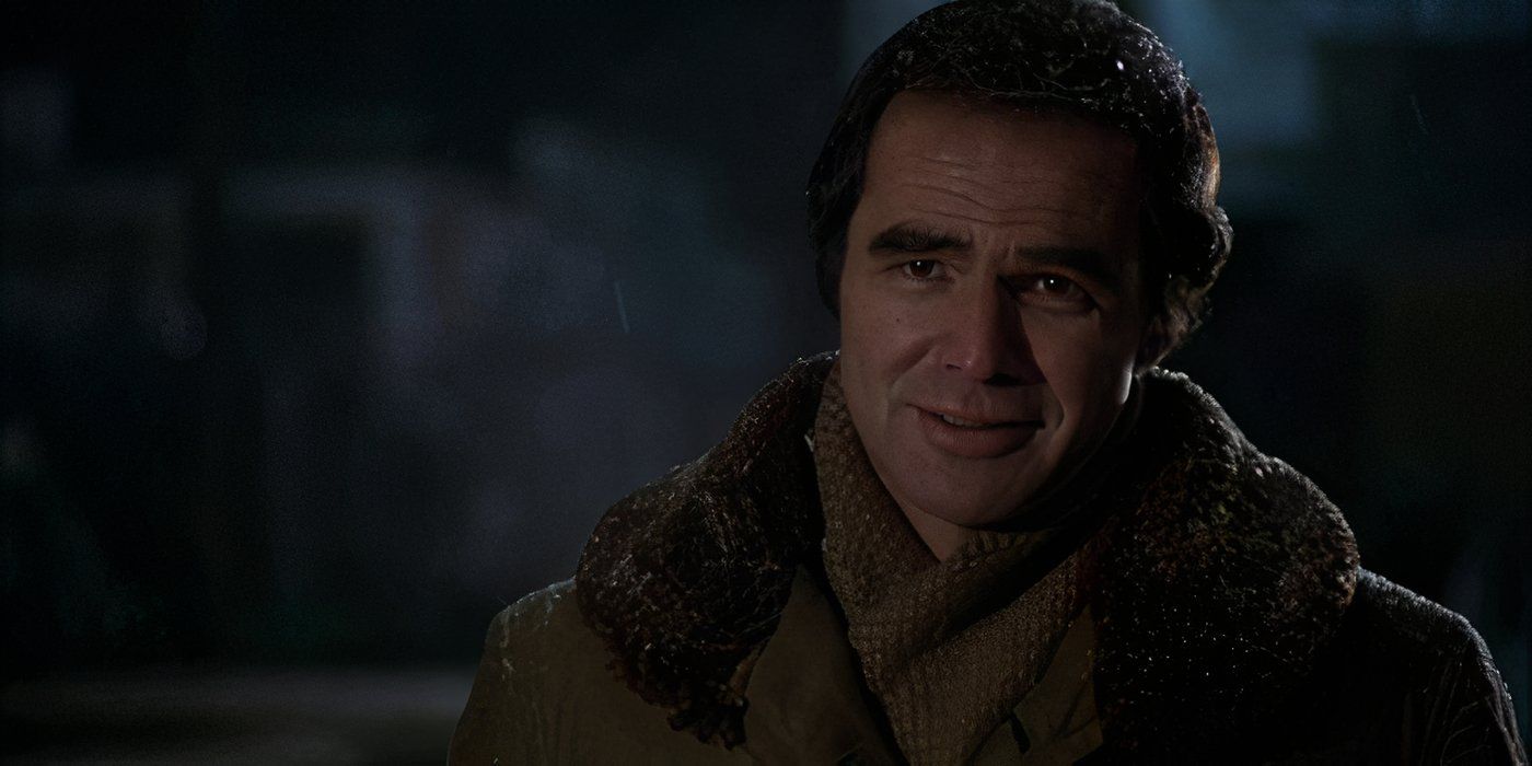 Burt Reynolds standing outside in a winter coat in 'Starting Over'