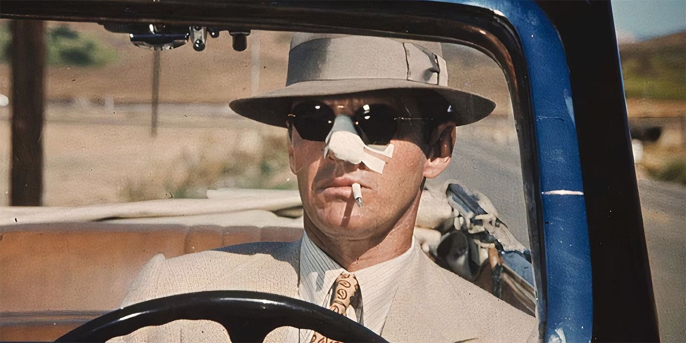 Jake Gittes with a bandage on his nose, in sunglasses and a hat, driving and smoking