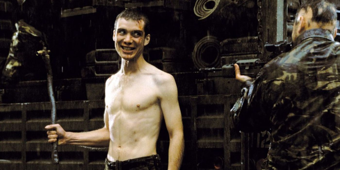 Cillian Murphy shirtless as Jim holding a crooked sword.