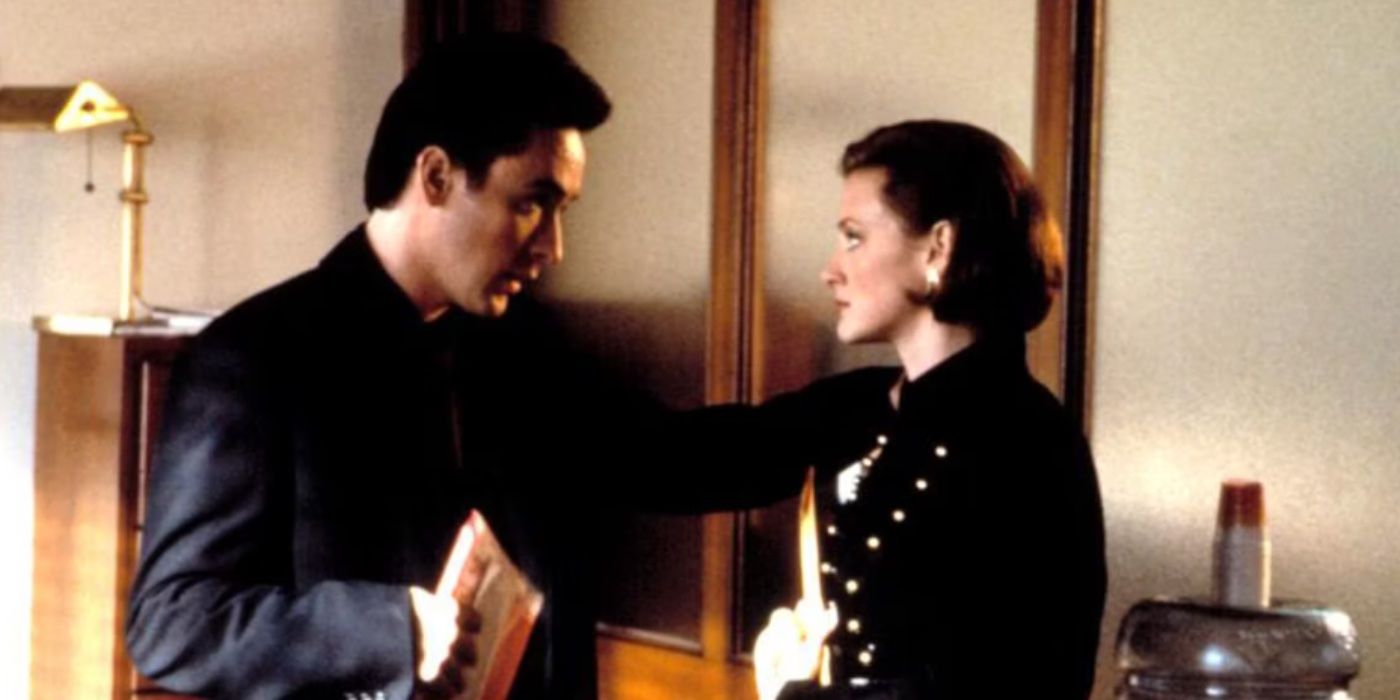 Martin (John Cusack) and Marcella (Joan Cusack) looking firmly into each other's eye as they converse. Martin's hand is placed on Marcella's shoulder. 