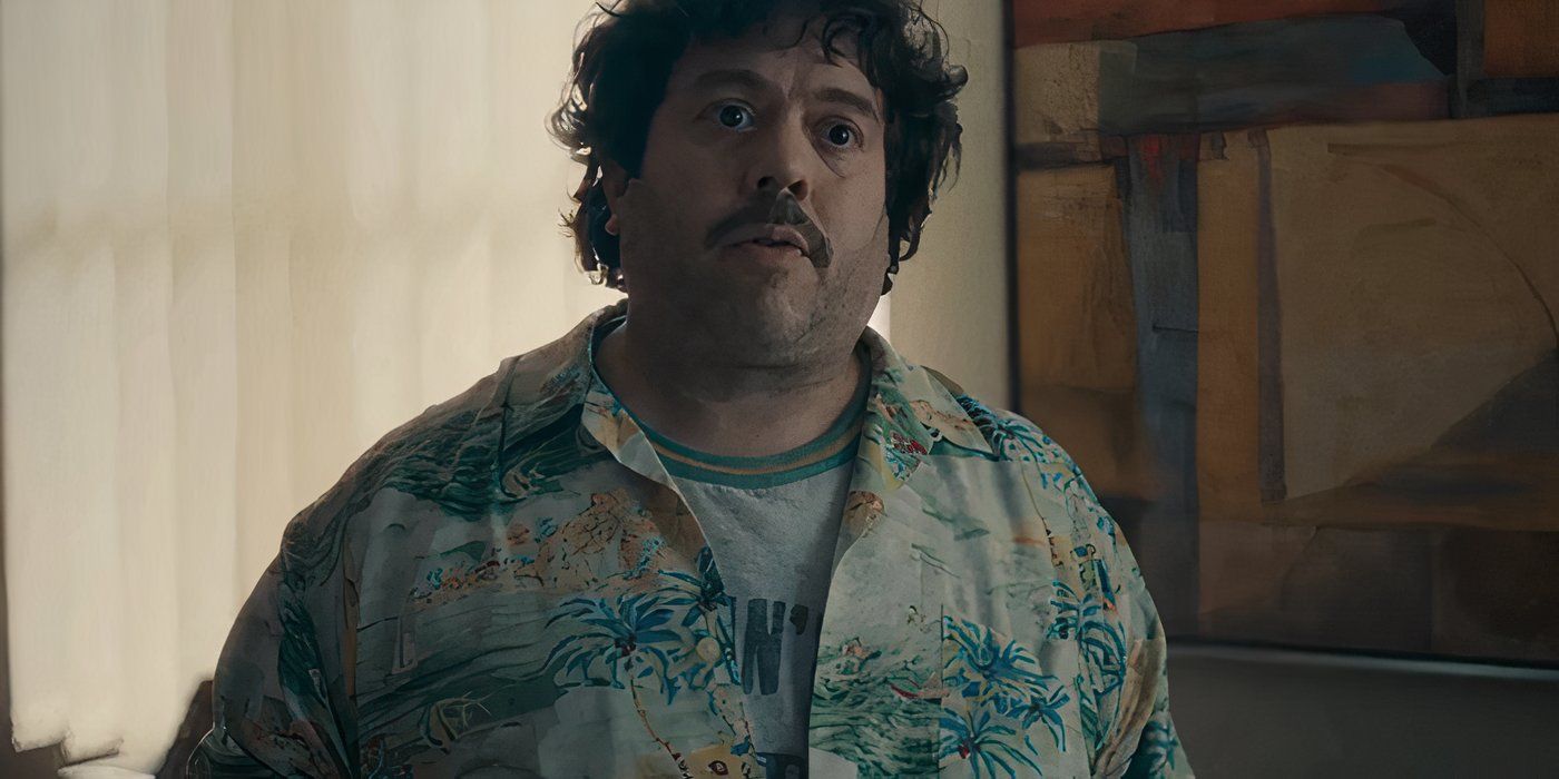 Dan Fogler as Lennie Wilson wearing a Hawaiian shirt and looking disheveled in Eric