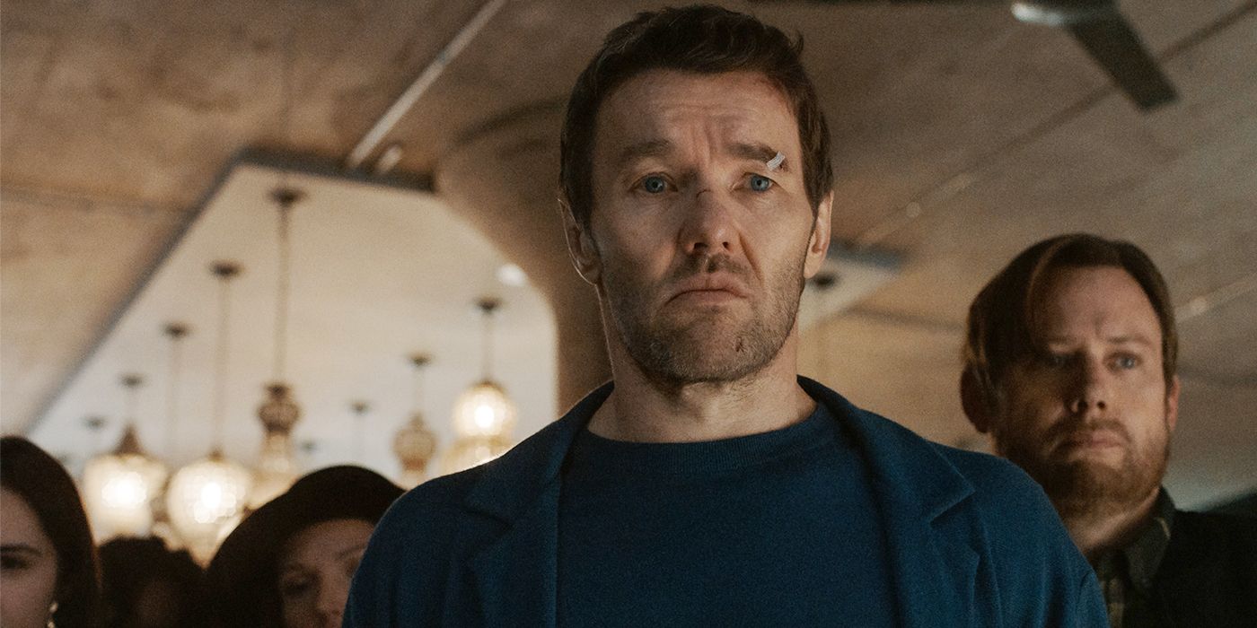 A bruised and cut Joel Edgerton looks off-camera with concern with Jimmi Simpson behind him