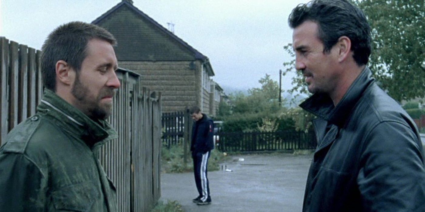Paddy Considine and Gary Stretch in a conversation, while Toby Kebbell stands behind, in Dead Man&rsquo;s Shoes