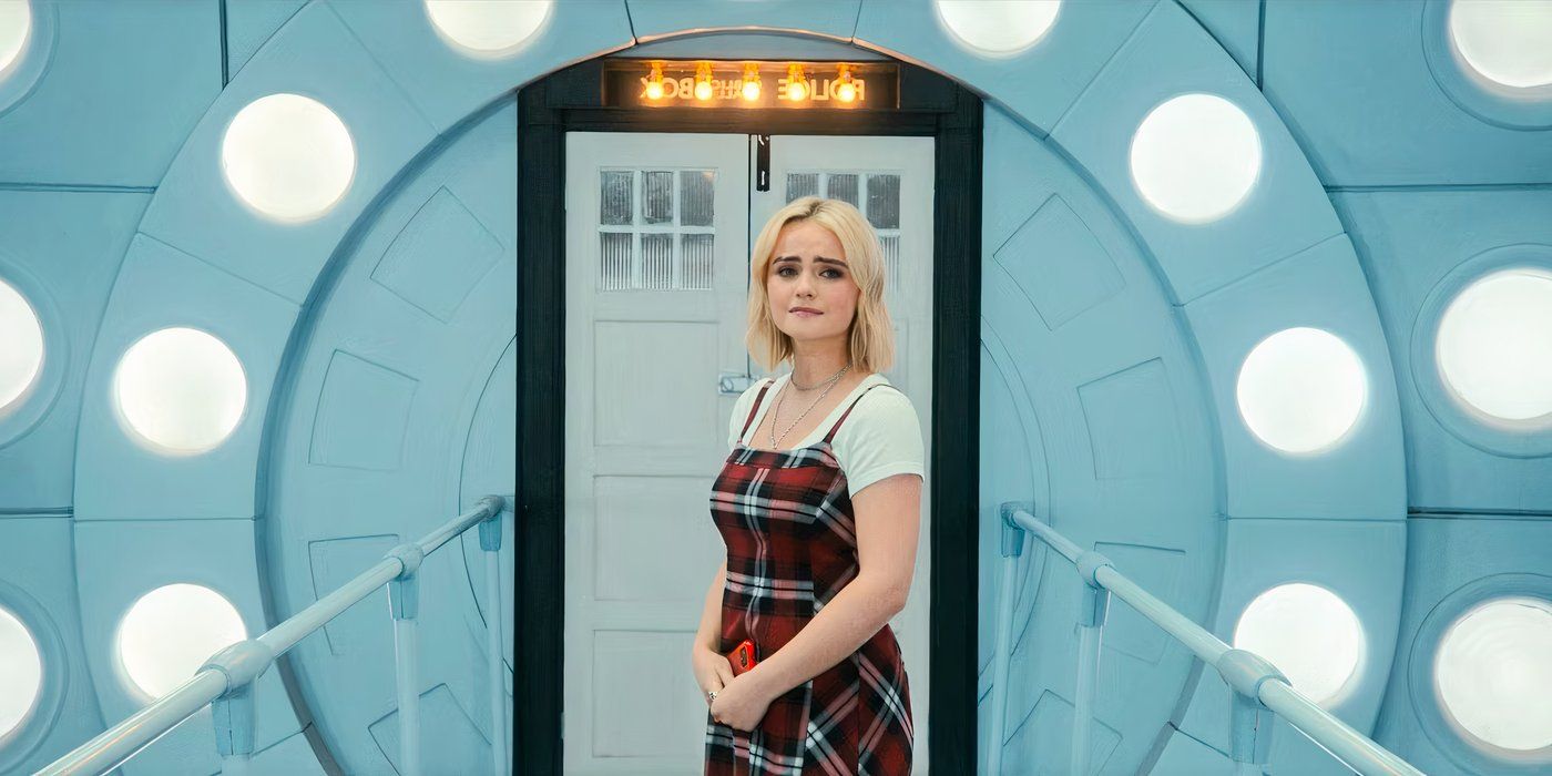 Ruby Sunday (Millie Gibson) stands outside the inner doors of the TARDIS and stares tearfully at the off-screen doctor in Doctor Who