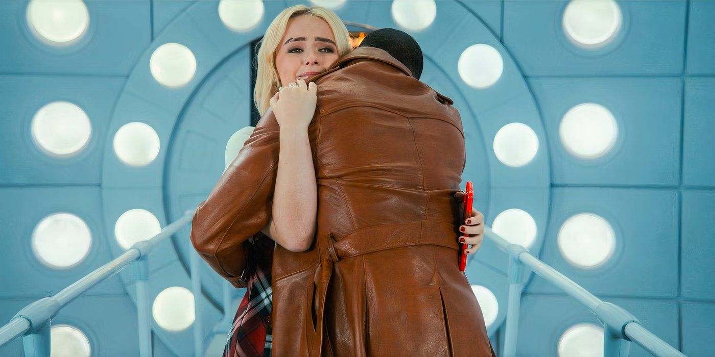 The Doctor (Ncuti Gatwa) and Ruby Sunday (Millie Gibson) hugging in the TARDIS interior, the Doctor with his back facing the screen and Ruby's tearful face emerging over his shoulder, in Doctor Who