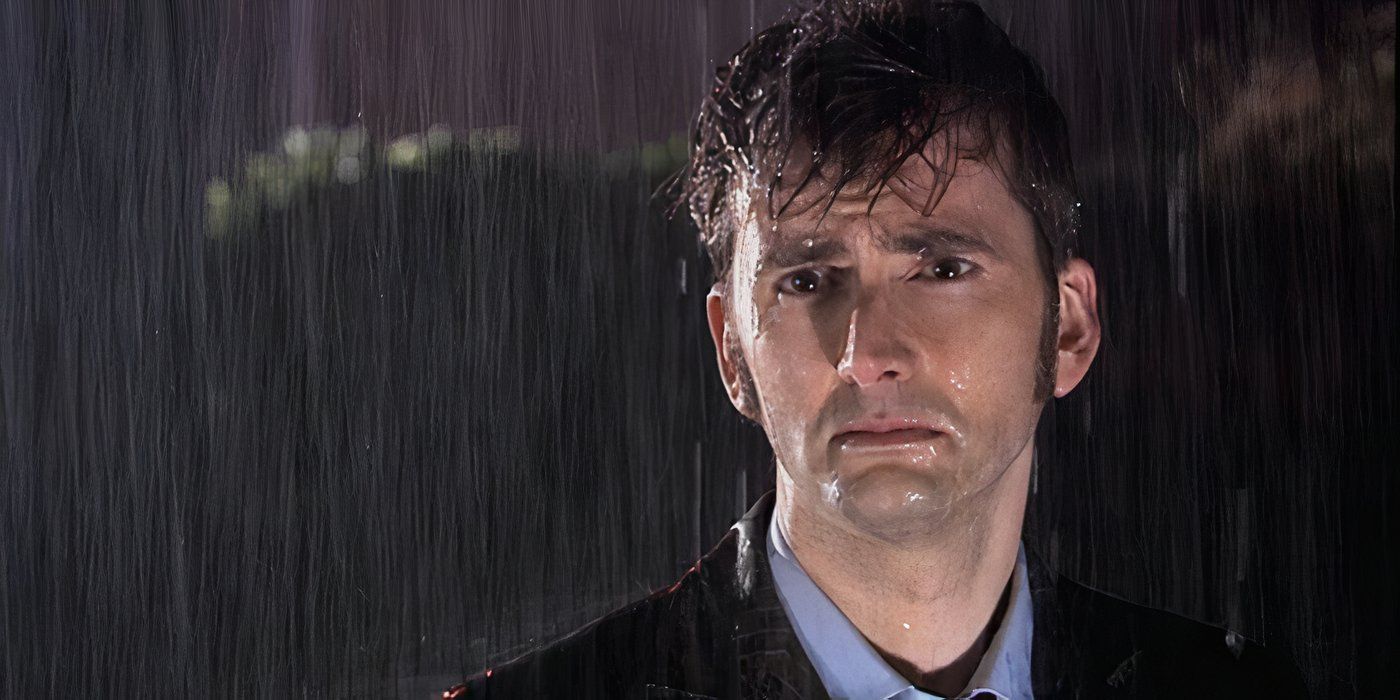 The Tenth Doctor looking despondent while getting drenched in the rain.