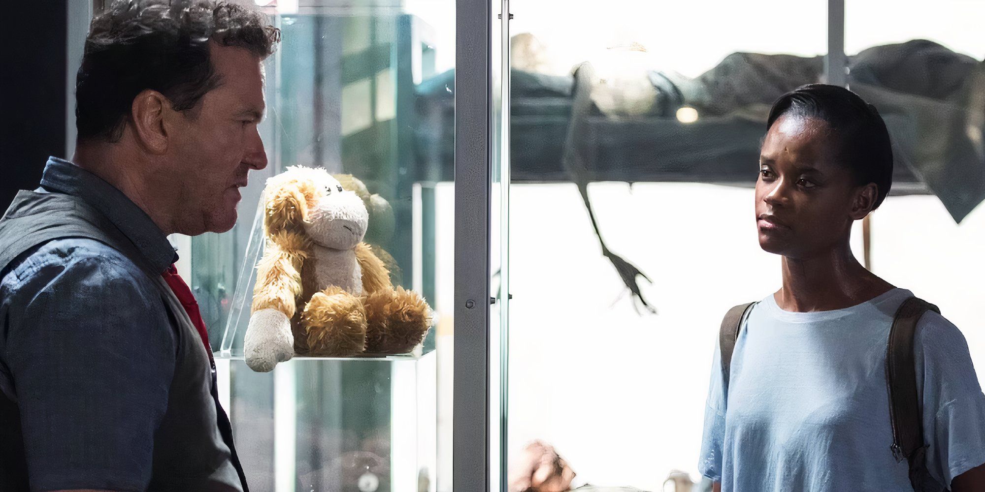 Letitia Wright as Nish looking at Douglas Hodge as Rolo in Black Museum in Black Mirror.