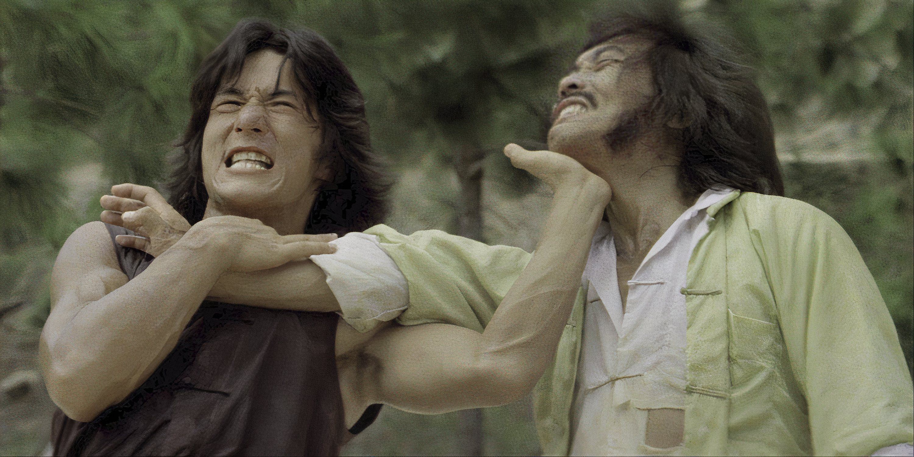 Jackie Chan fighting another man in Drunken Master