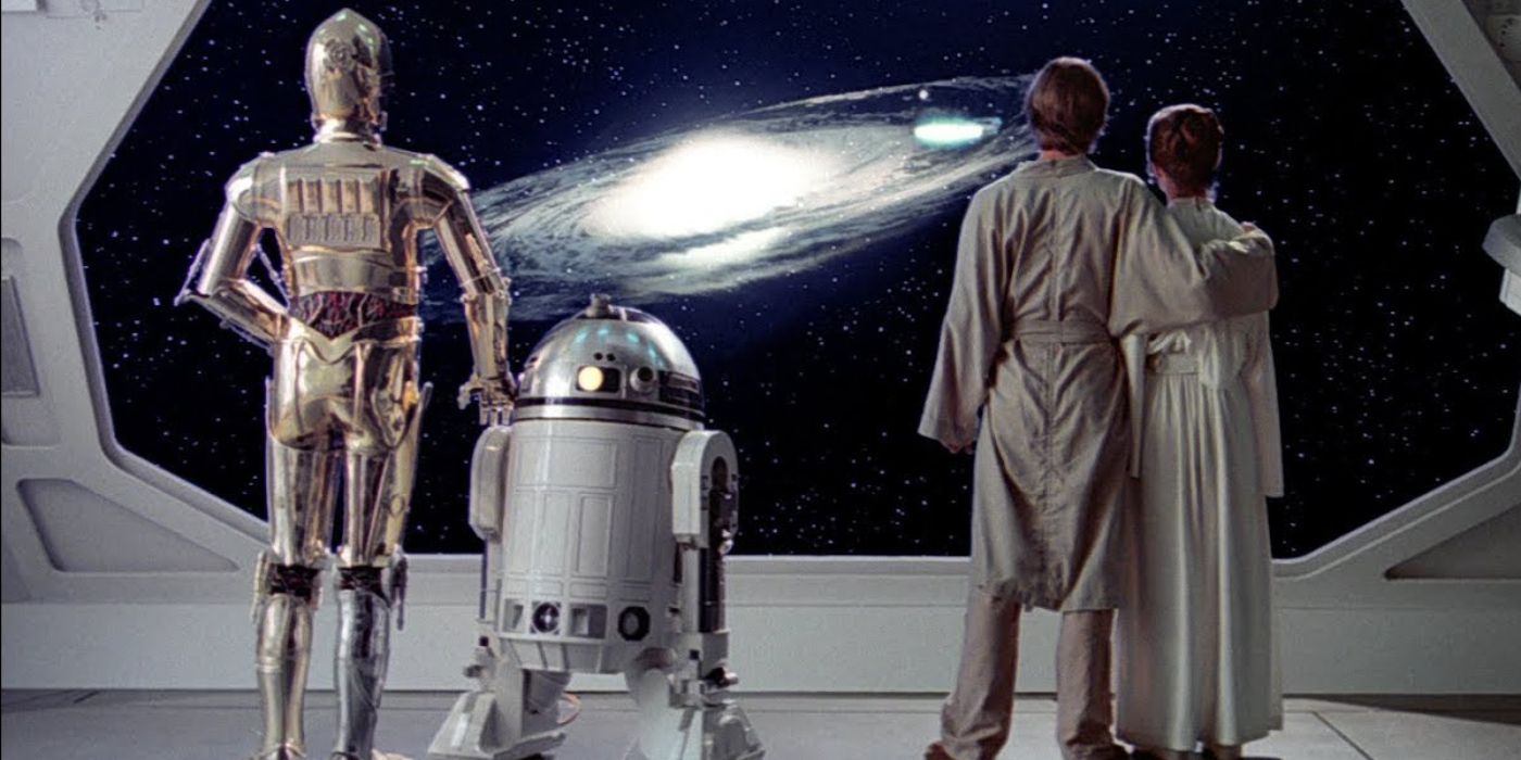 The final shot of 'Star Wars: The Empire Strikes Back' with R2-D2 (Kenny Baker), C-3PO (Anthony Daniels), Luke (Mark Hamill), and Leia (Carrie Fisher) overlooking a planet in the galaxy.