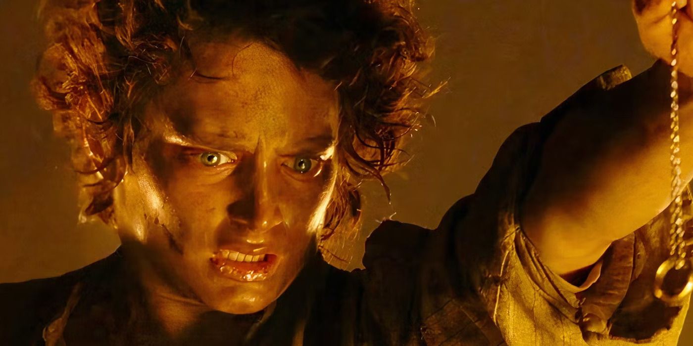 Elijah Wood as Frodo holds up the one ring in The Lord of the Rings: The Return of the King. 