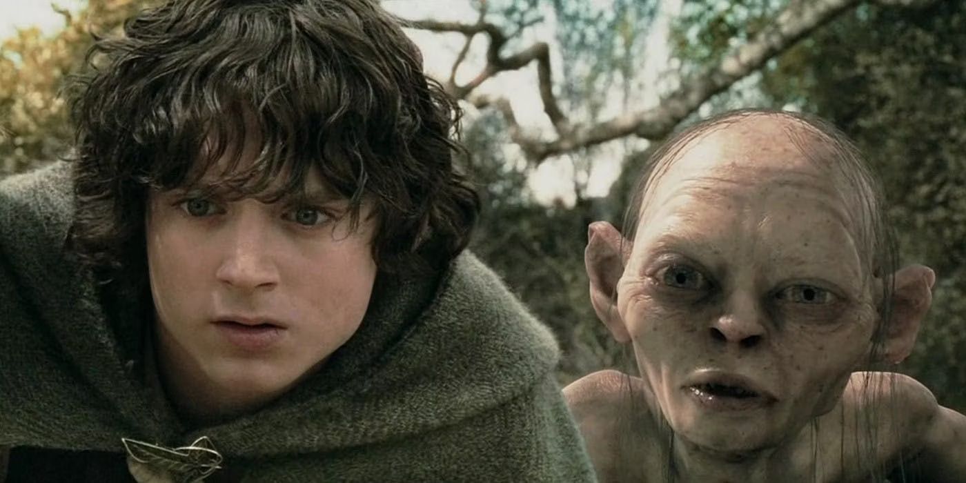 Frodo Baggins (Elijah Wood) and Gollum (Andy Serkis) crouch down in a dense, bushy area as they peer over to look at something in 'The Lord of the Rings: The Two Towers' (2002).