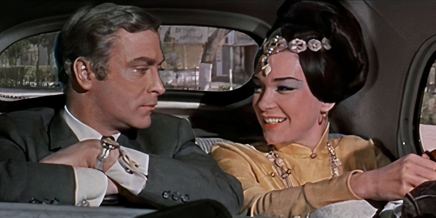 Gambit- Shirley MacLaine and Michael Caine in back seat of car 