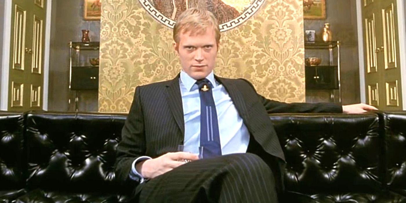 Paul Bettany as a young gangster sitting on a sofa in Gangster No. 1