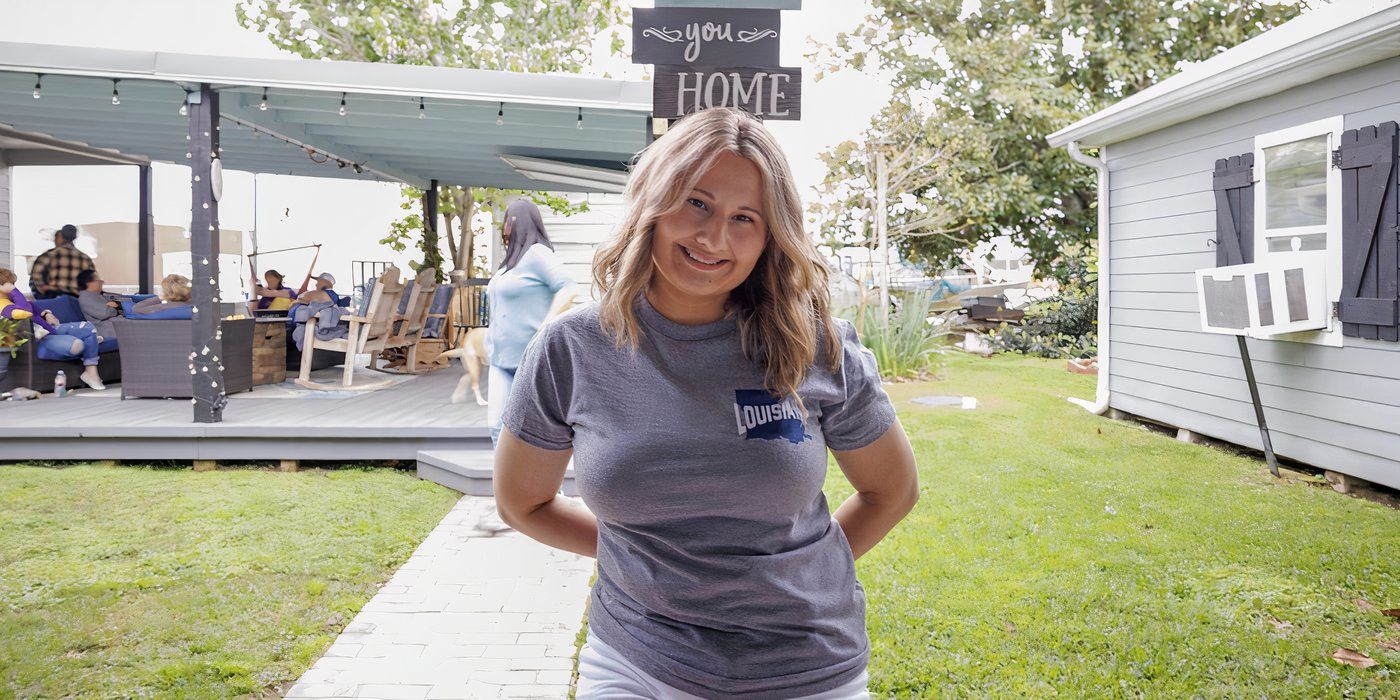 Gypsy Rose Blanchard stands in front of a wooden post 