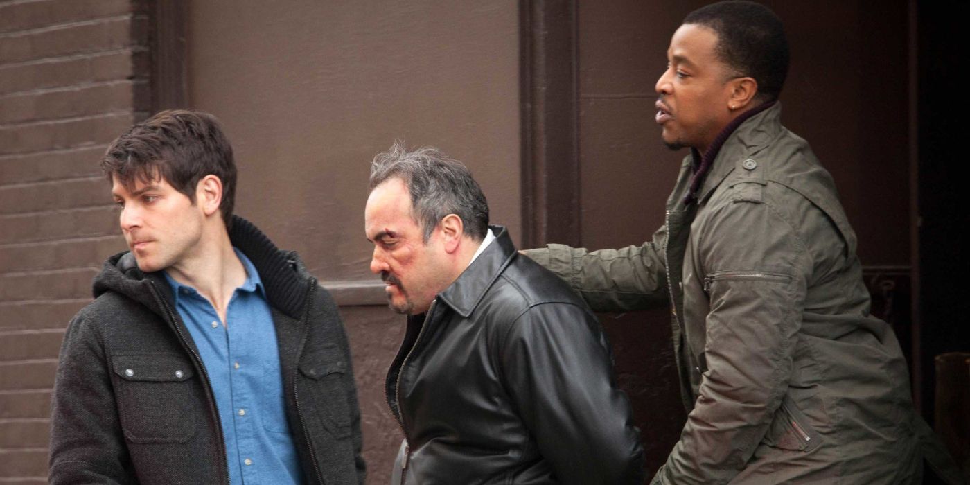Nick Burkhardt (David Giuntoli) and Hank Griffin (Russell Hornsby) arrest a beaten up Salvadore Butrell (David Zayas) in 'Grimm' Season 1, Episode 18 "Leave it to Beavers" (2012).