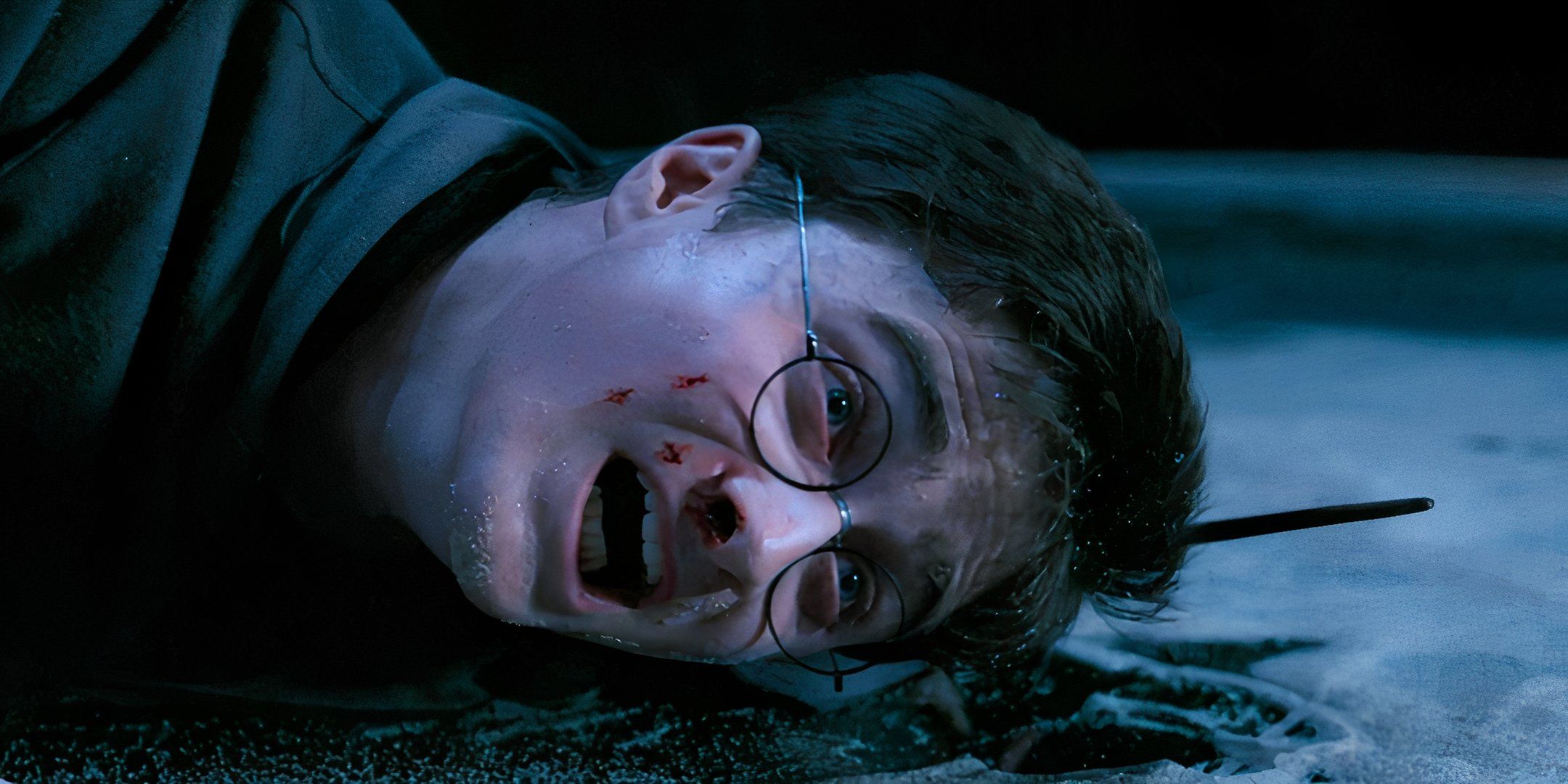 Harry (Daniel Radcliffe) struggles on the floor of the Ministry of Magic in 'Harry Potter and the Order of the Phoenix'