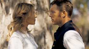 Sienna Miller as Frances looking at Sam Worthington as Gephart outside in Horizon: An American Saga