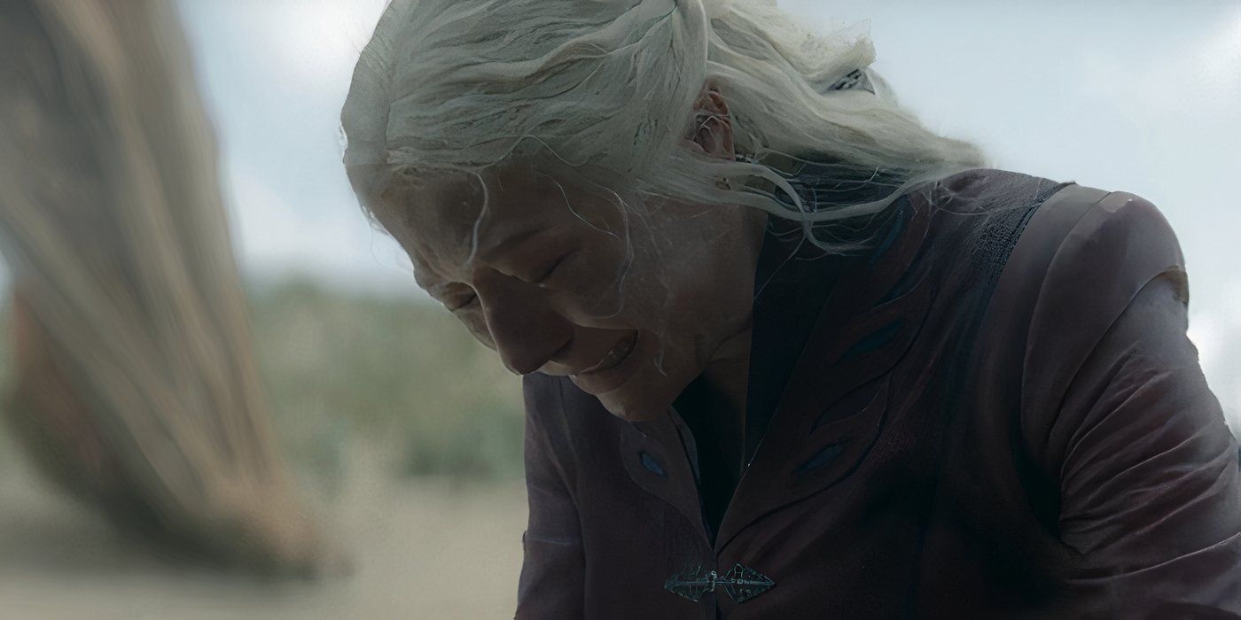 Rhaenyra Targaryen (Emma D&rsquo;Arcy) kneeling on the beach and weeping with her head bowed in House of the Dragon