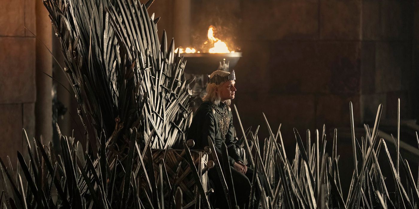Tom Glynn-Carney as Aegon II sitting on the Iron Throne in House of the Dragon Season 2