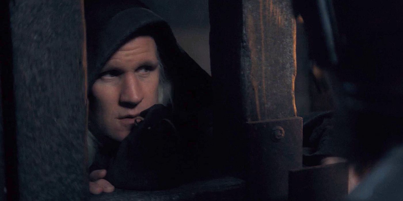 Matt Smith as Daemon wearing a cloak and approaching a Goldcloak in House of the Dragon