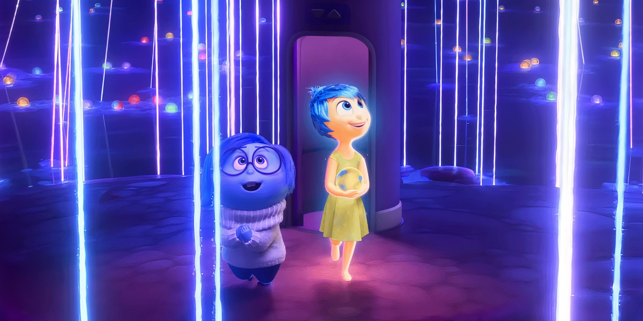 Amy Pohler as Joy and Phyllis Smith as Sadness looking at Riley's beliefs in Inside Out 2.