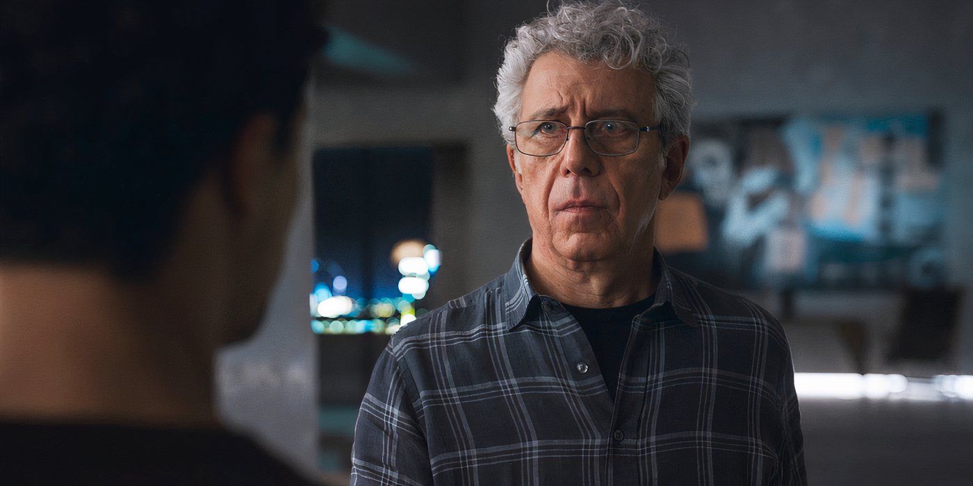 Daniel Molloy (Eric Bogosian) facing the camera and looking slightly offscreen at Louis (Jacob Anderson), the back of whose head is on the left and slightly out of focus, in Interview with the Vampire