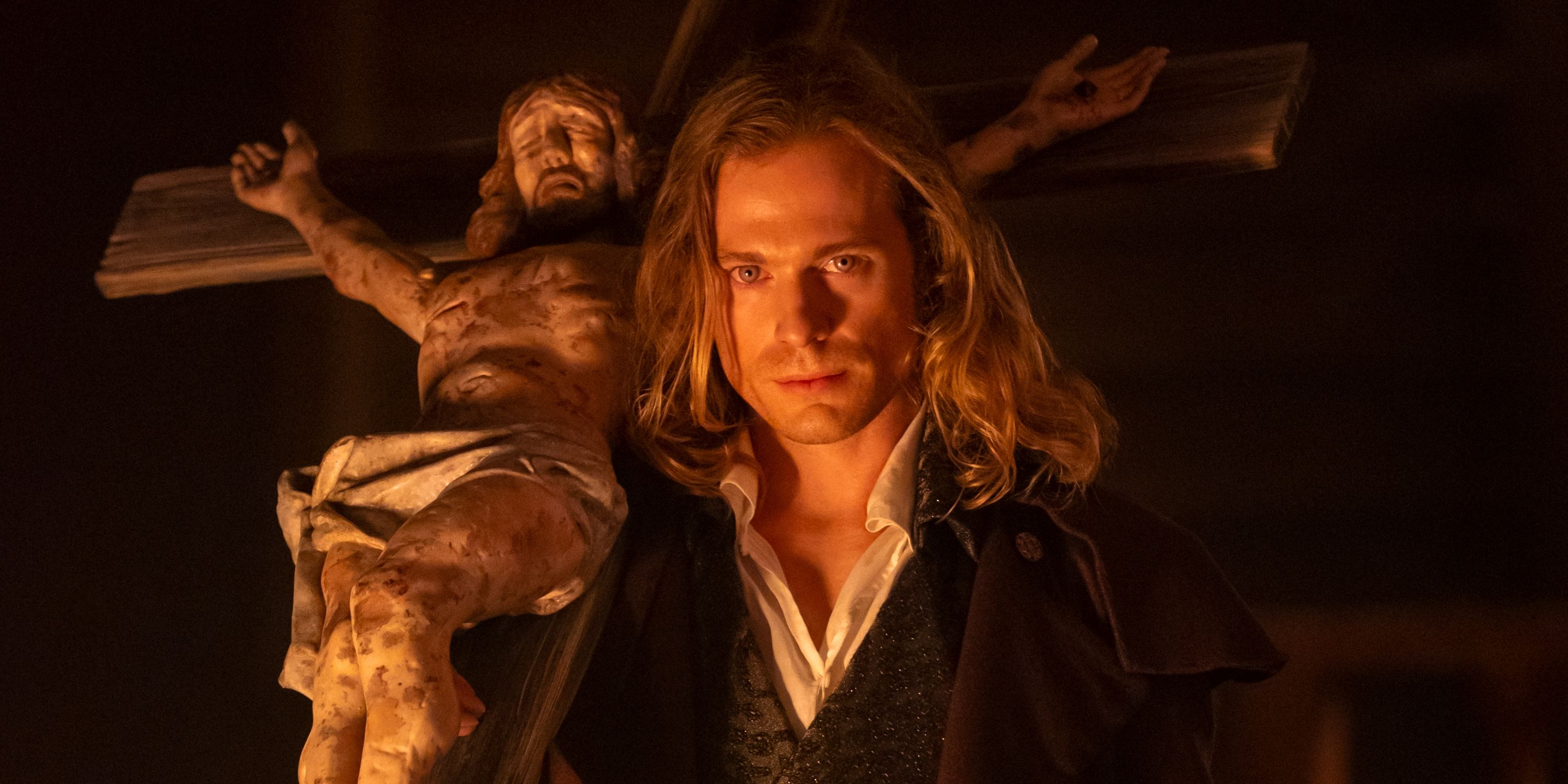 Sam Reid as Lestat carrying a cross with Jesus in an AMC promo gallery of the second season of Interview with the Vampire