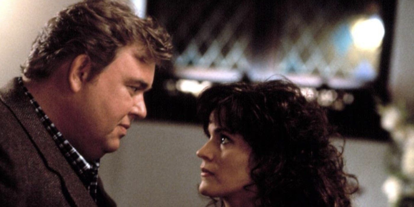 Danny Muldoon (John Candy) and Theresa Luna (Ally Sheedy) look intently at each other in 'Only the Lonely'