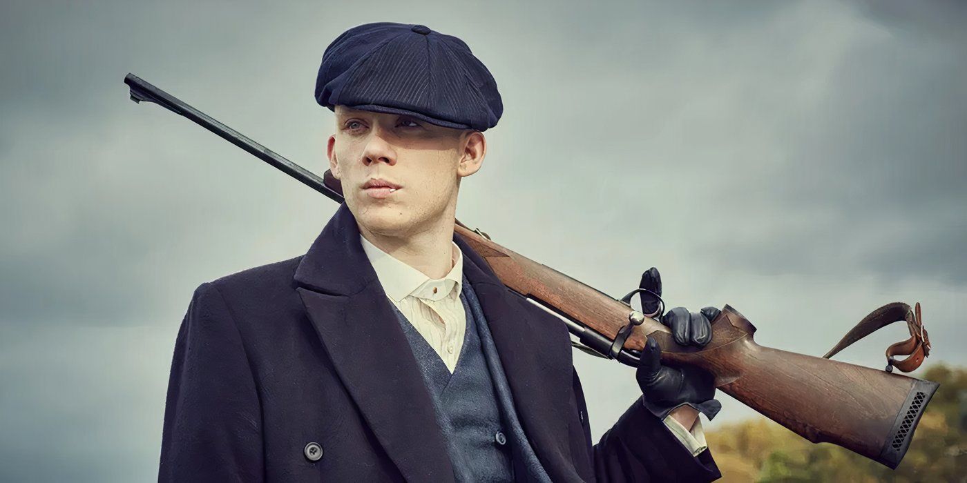 Joe Cole, holding a gun, as John Shelby in Peaky Blinders