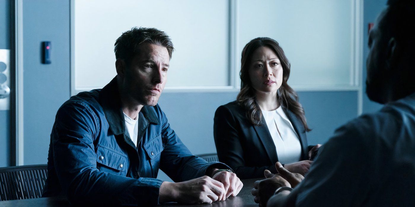 Justin Hartley as Colter Shaw and Fiona Renee as Reenie Greene sit across from a suspect in an interrogation room on CBS' 'Tracker​​​​​​​.'