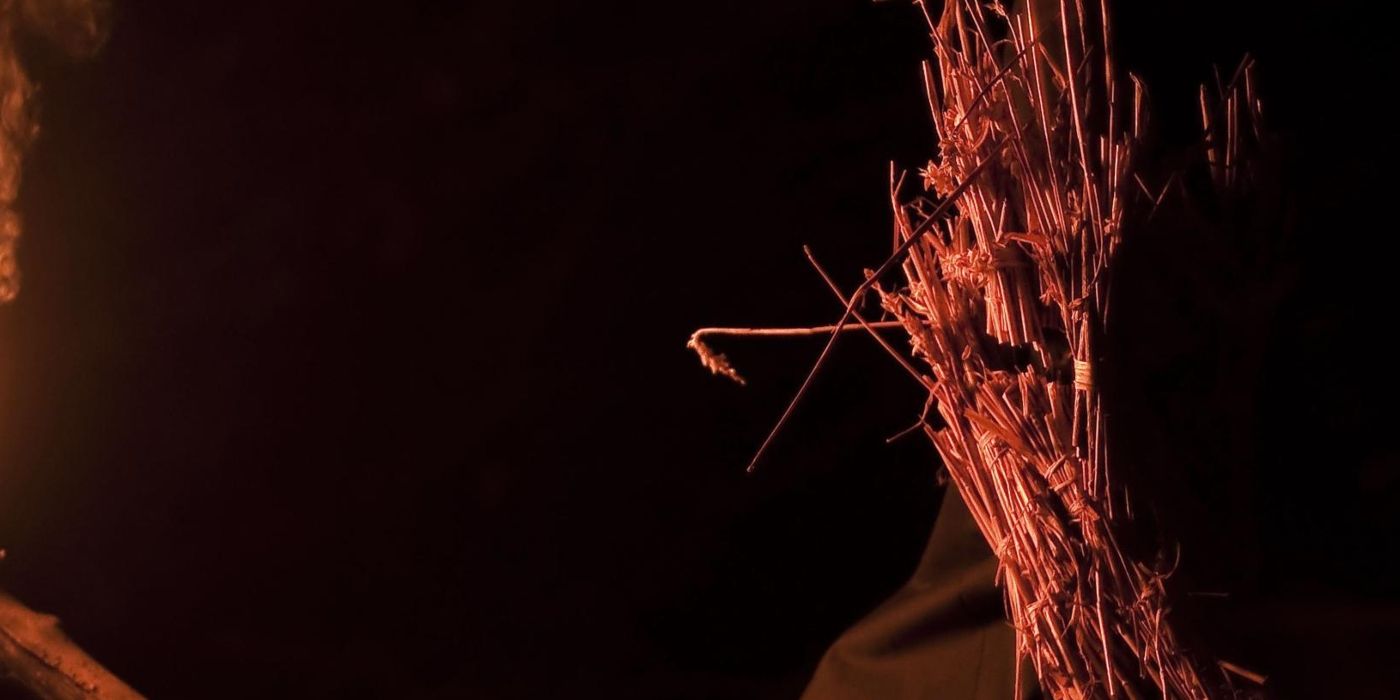 A cult member in Kill List wearing a straw mask