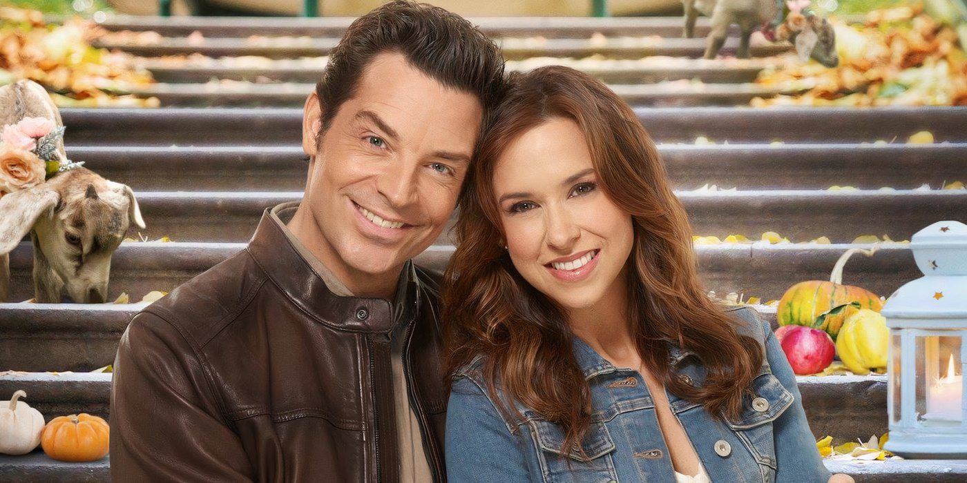 Brennan Elliott and Lacey Chabert sitting on a staircase with apples and goats in a Hallmark Movie