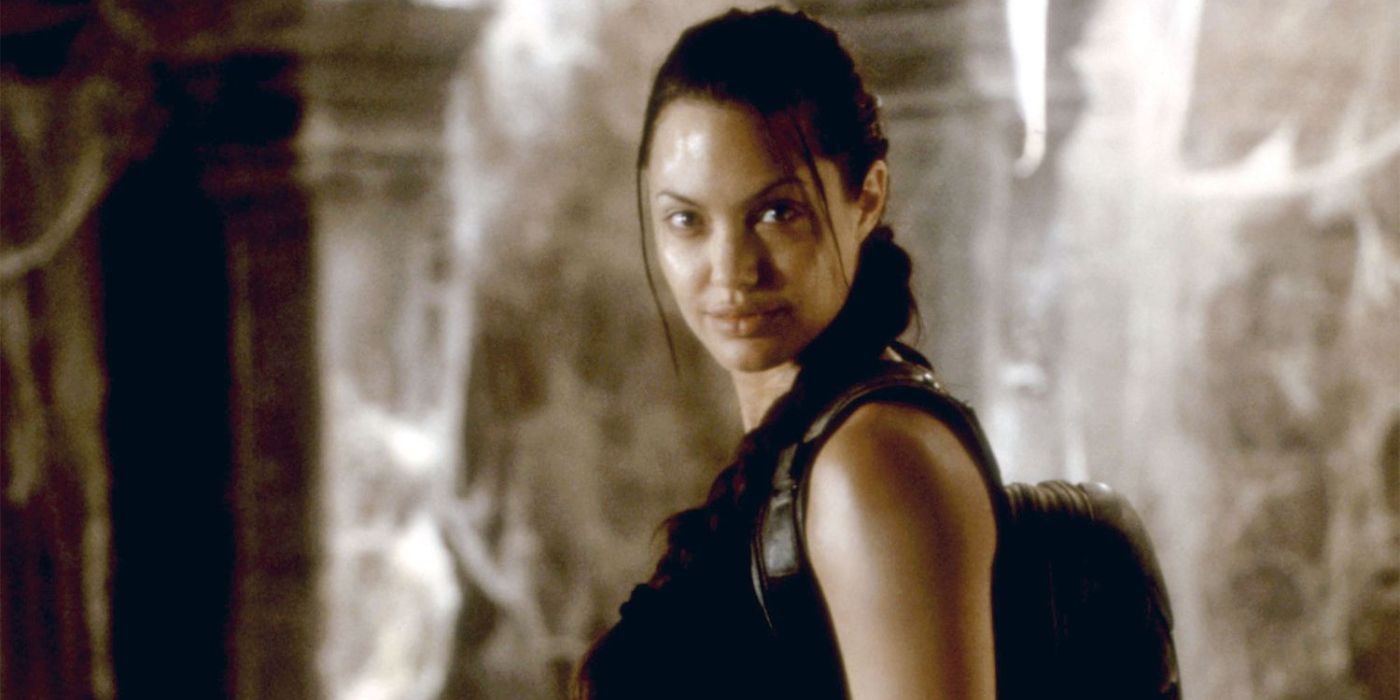 Lara Croft stands with a confident look in a hazy tomb in 'Lara Croft: Tomb Raider' (2001).