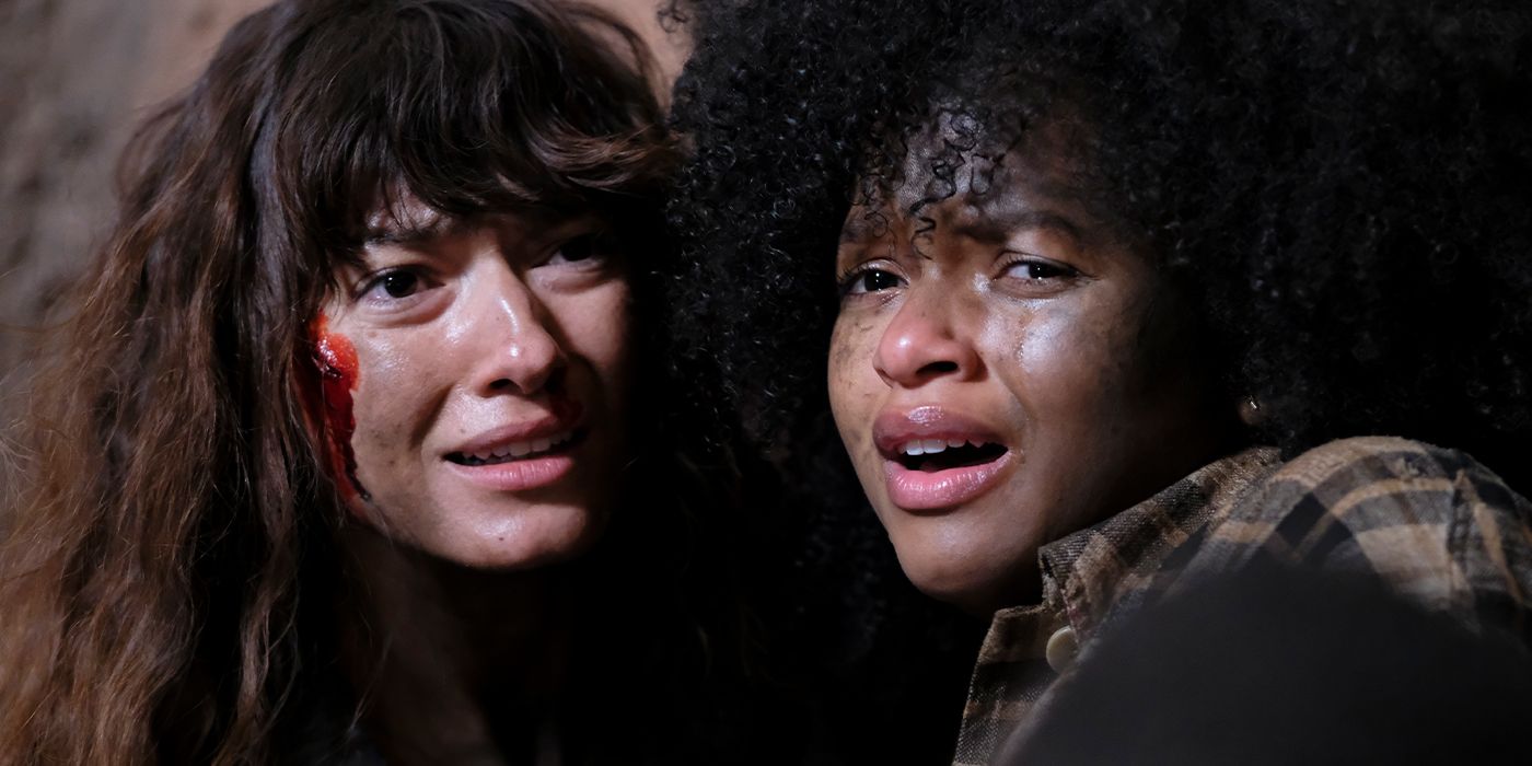 Andrea Tivadar and Sidney Nicole Rogers as Delilah and Patrica, huddling together crying with blood on their faces in Lumina
