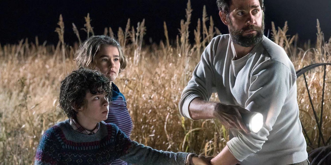 Marcus (Noah Jupe), Regan (Millicent Simmonds) and Lee (John Krasinski) on the lookout for the aliens in 'A Quiet Place'