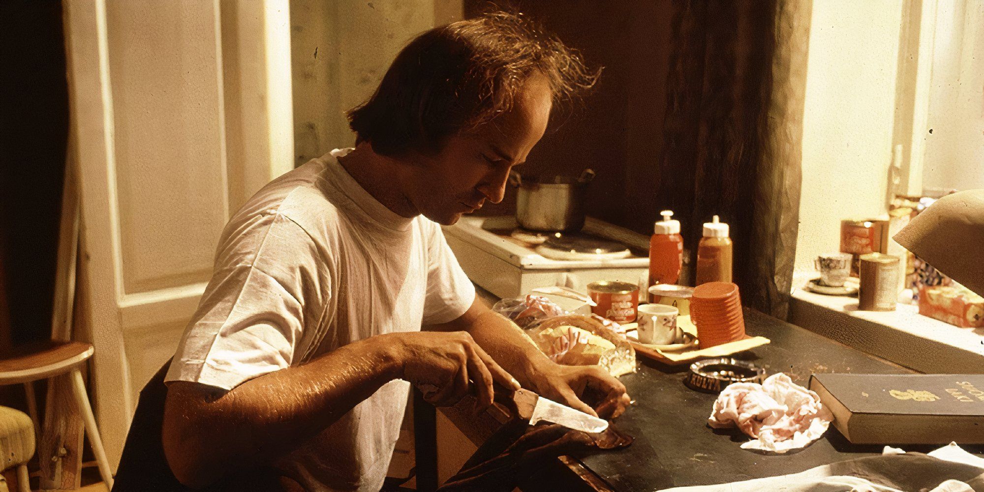 Markku Toikka in Crime and Punishment holding a knife.