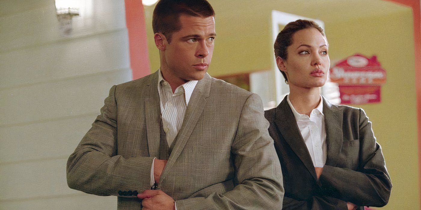 John reaches into his jacket as Jane does the same in Mr. and Mrs. Smith