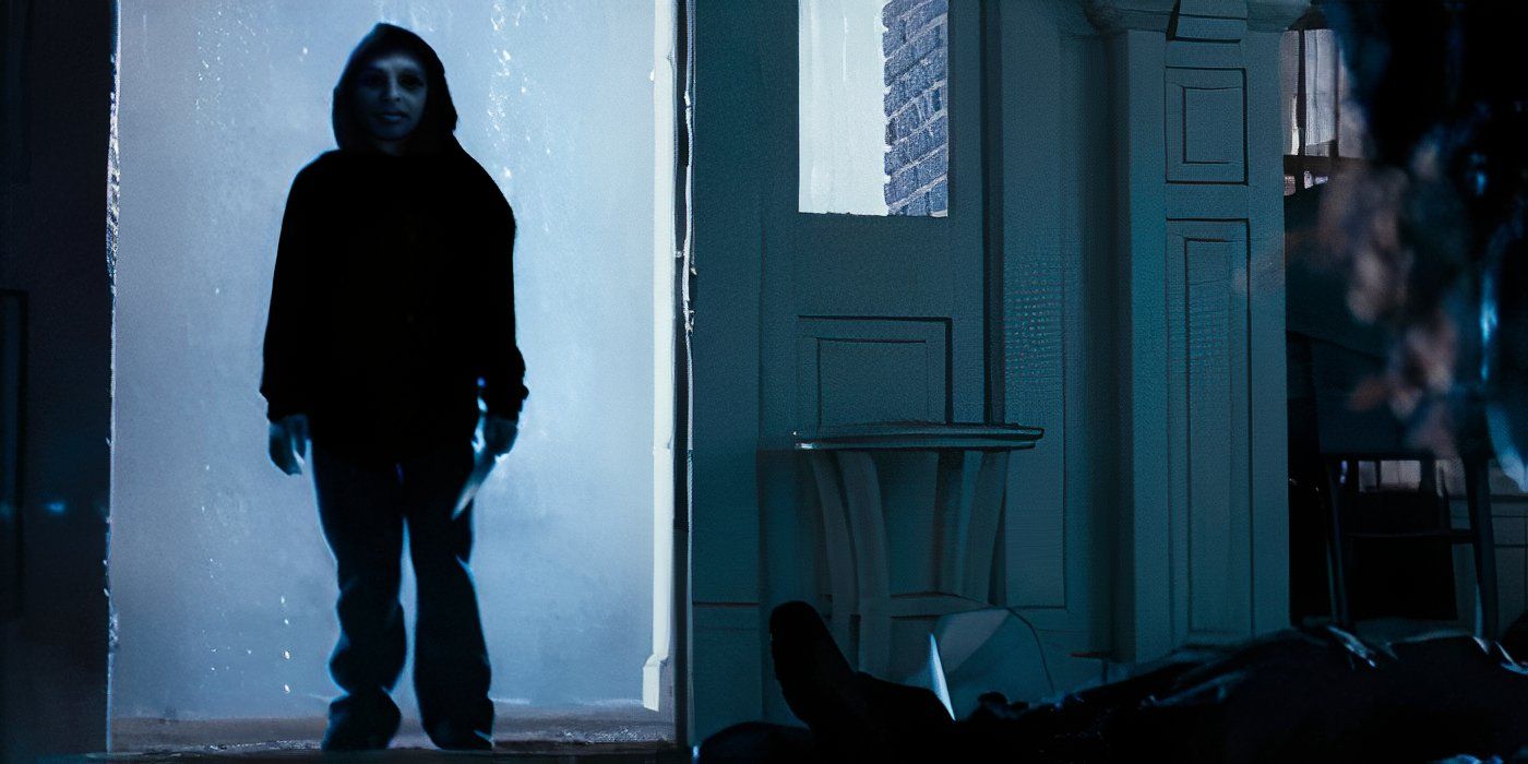 A mysterious, evil figure standing in the doorframe while a man on the right is on the ground and possibly dead in 'One Missed Call' (2008)