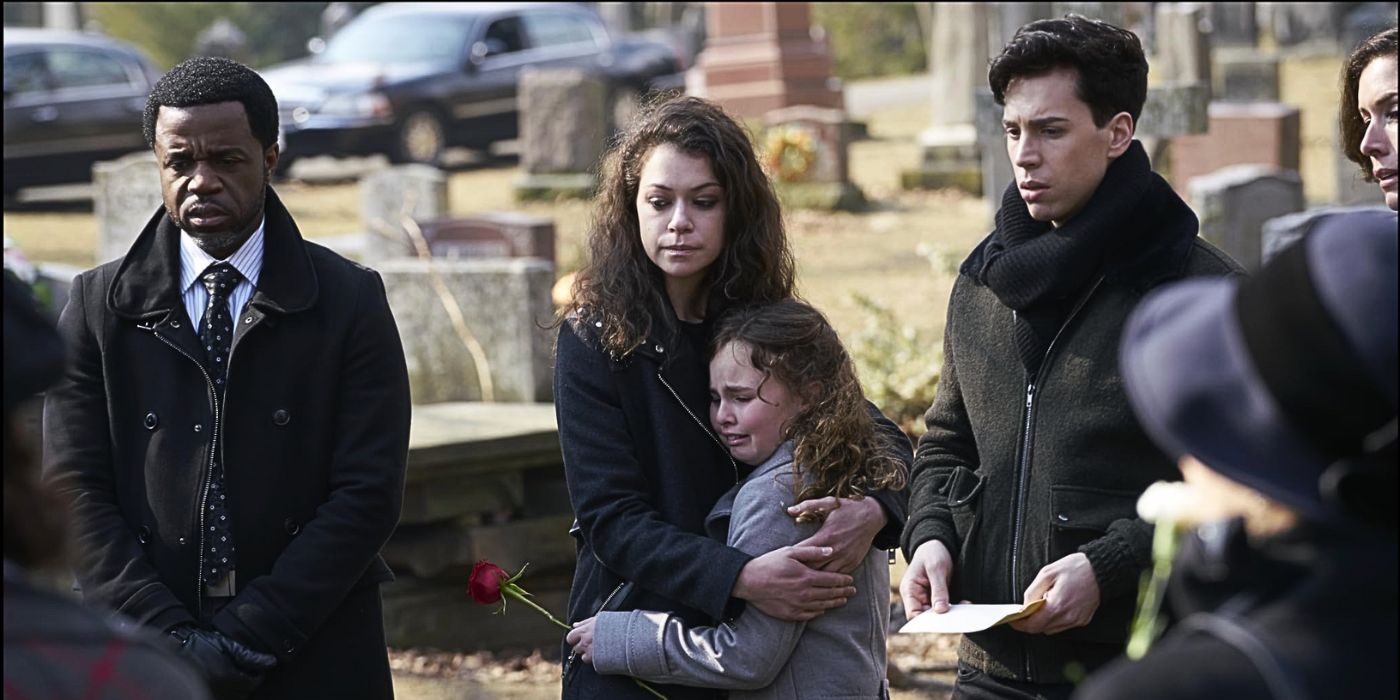 Tatiana Maslany as clone Sarah attends Siobhan's funeral graveside with her daughter and brother in the episode One Fettered Slave from Orphan Black