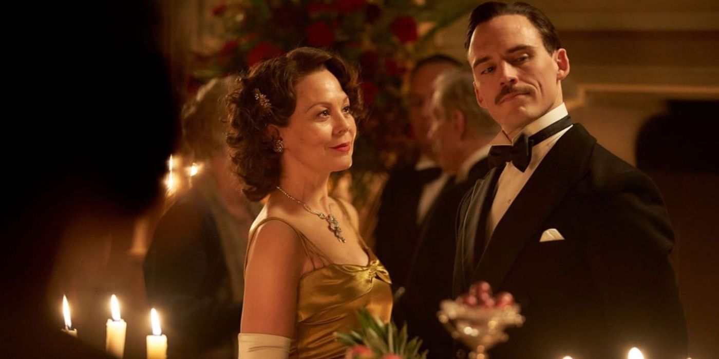 Polly Shelby (Helen McCrory) and Oswald Mosley (Sam Claflin) engage each other at a lavish party in 'Peaky Blinders' Season 5, Episode 4 "The Loop" (2019).