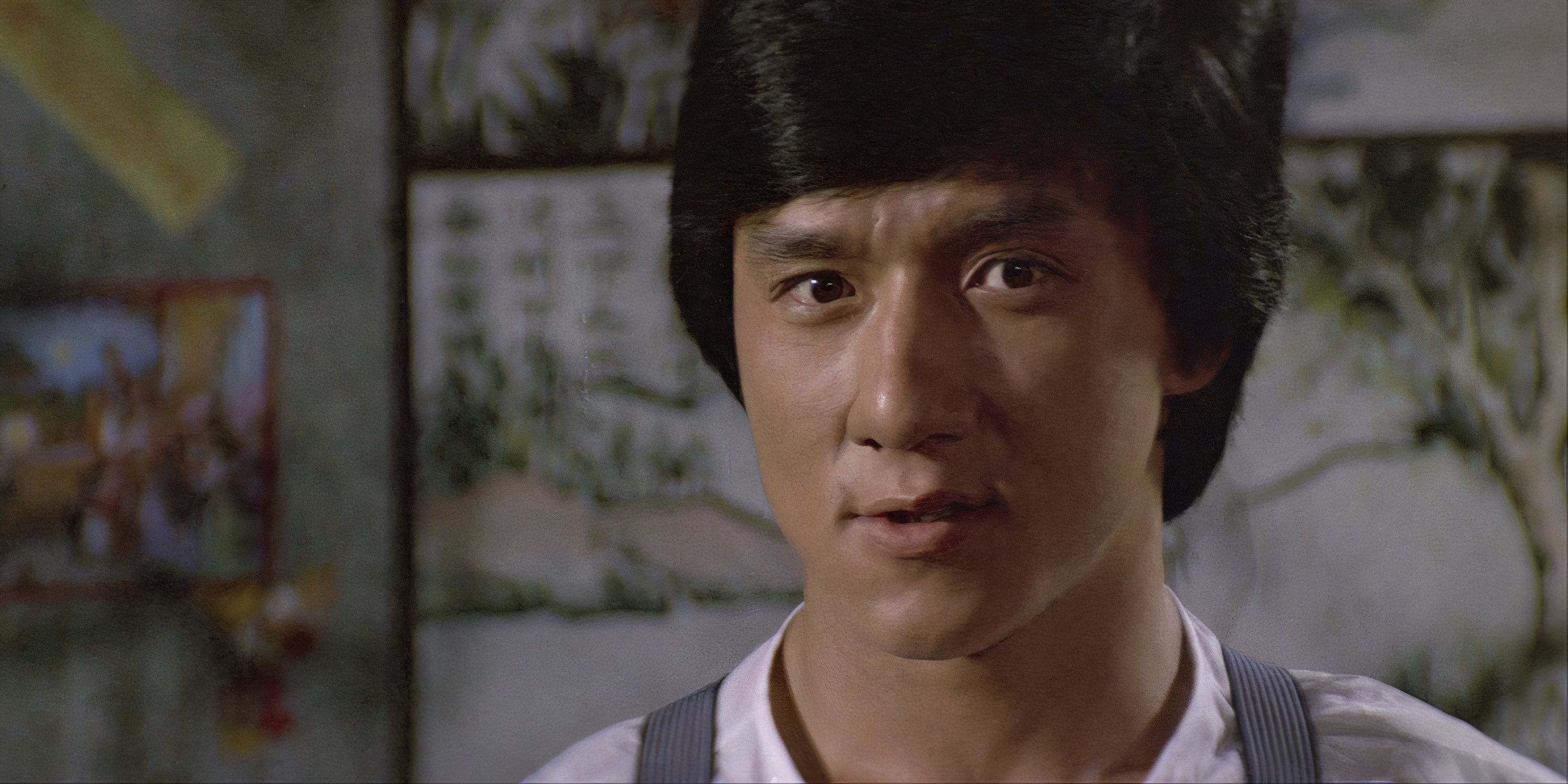 Jackie Chan looking at something off-camera in Project A