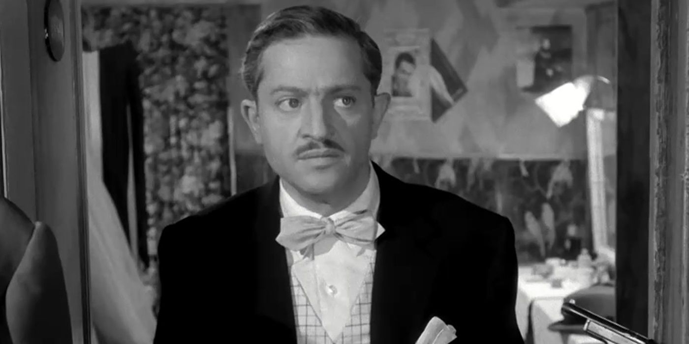 Jules Dassin as César "le Milanais" looking at a person offscreen in Rififi