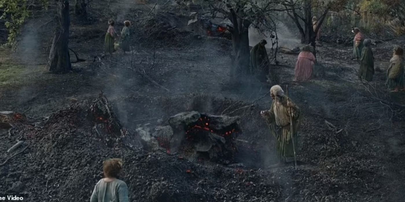 The Harfoots around burnt land in 'The Rings of Power.'