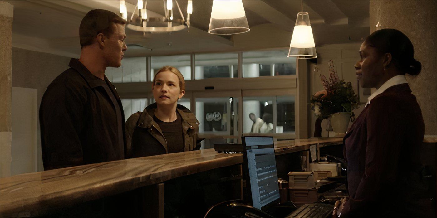 Roscoe and Reacher checking in to a hotel in Reacher season 1, episode 4