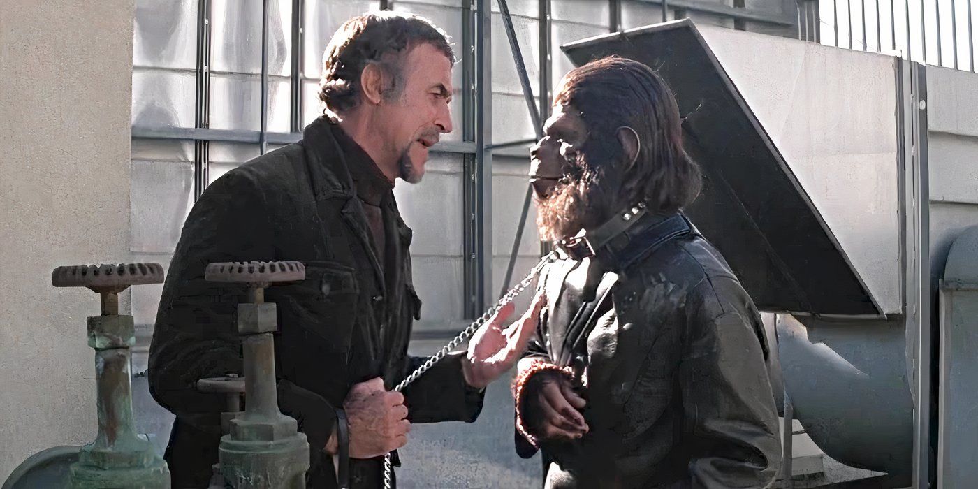 Armando (Ricardo Montalban) holding Caesar (Roddy McDowall) by a chain around his neck in Conquest of the Planet of the Apes