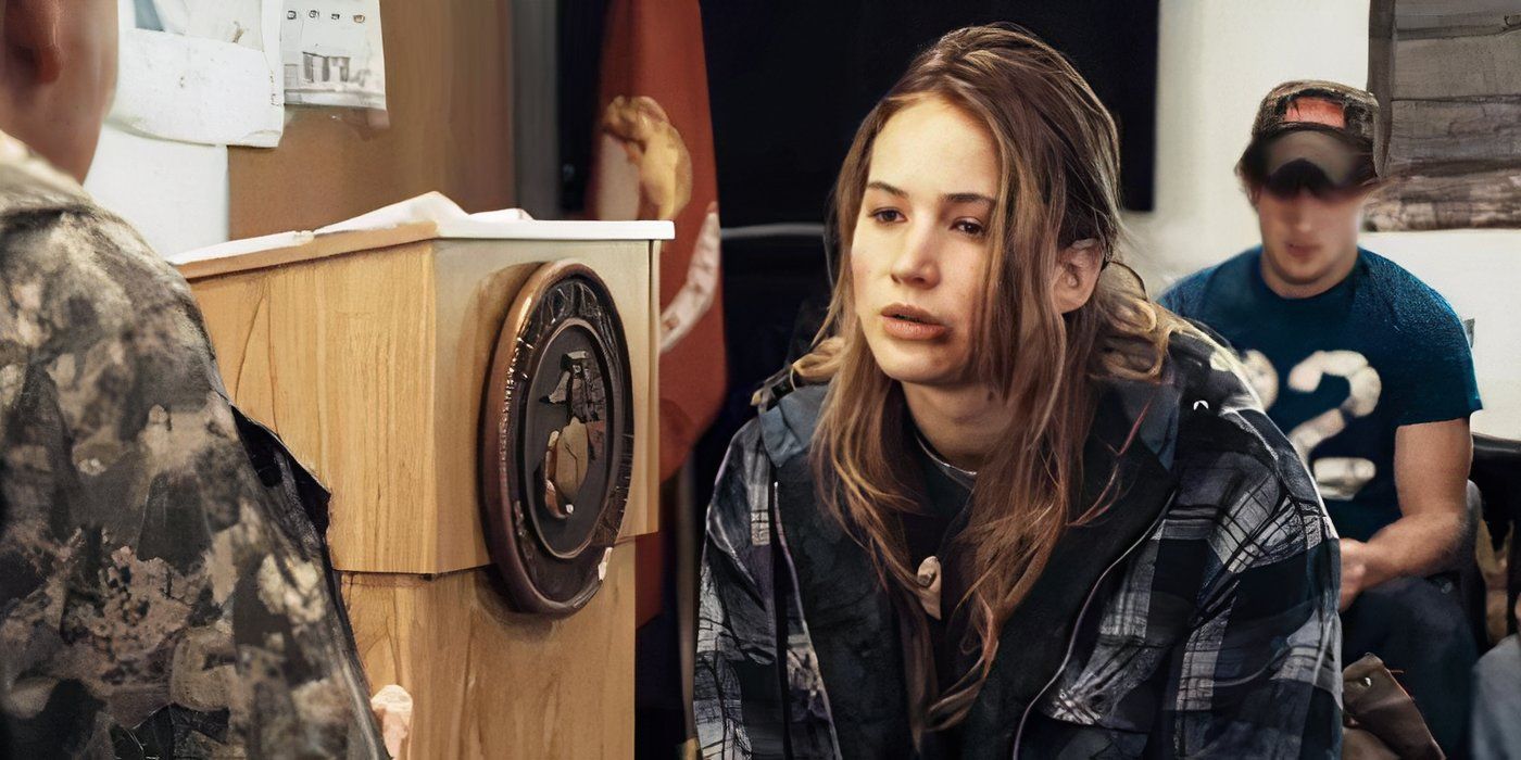 Jennifer Lawrence as Ree sitting at a desk with a bruised face in 'Winter's Bone'